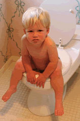 unhappy kid on toilet