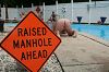 Click here to see the picture (RaisedManhole.jpg)